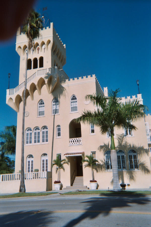 A Mediterranean Revival apartment building on Davis Islands with arched windows and a barrel-tile roof, present day.